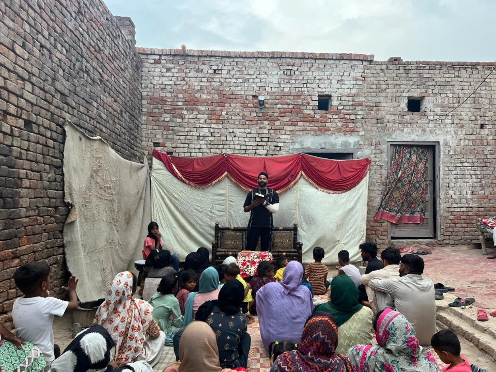 Teacher and pupils at a brick-kiln school